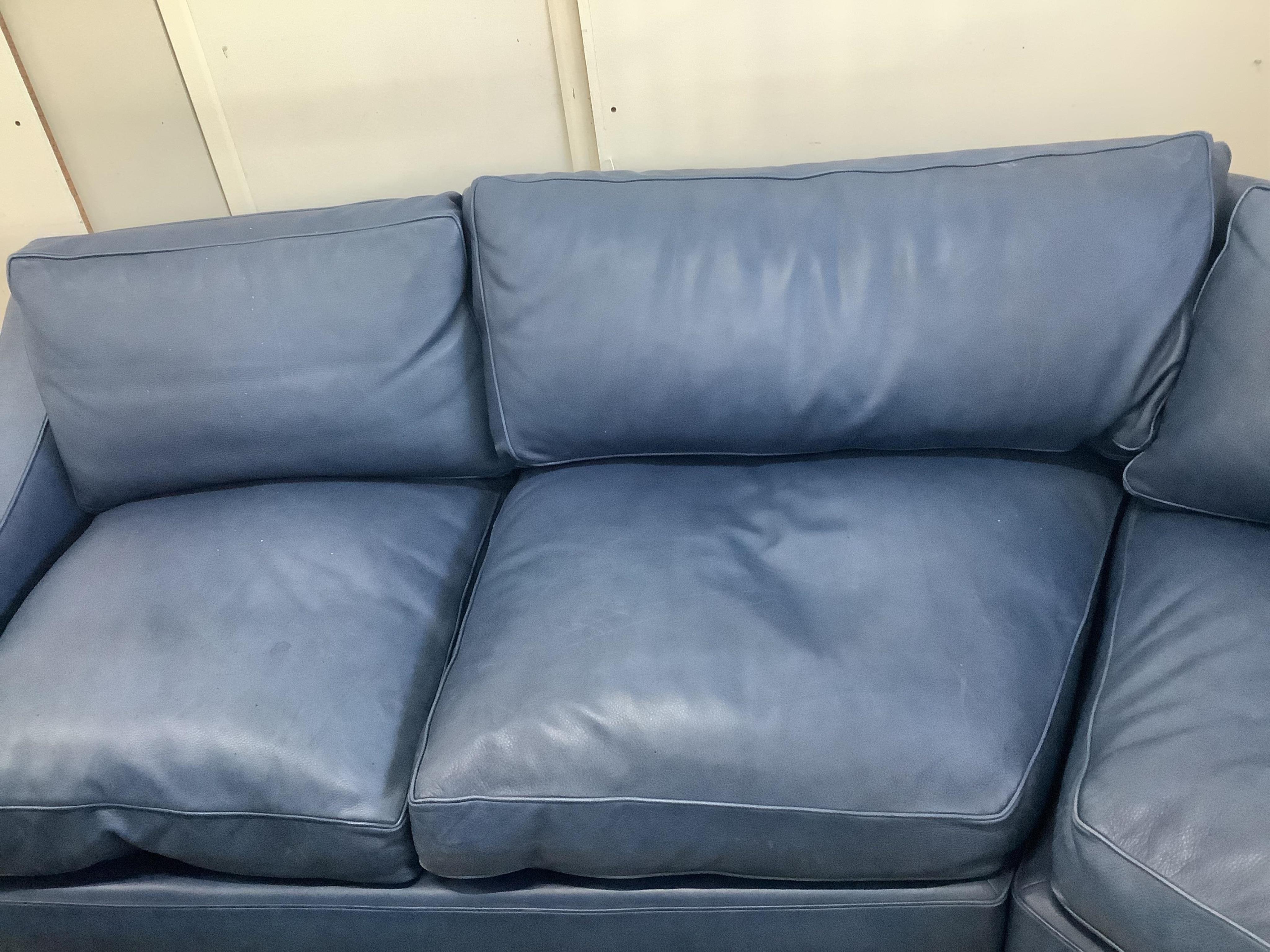 A Contemporary blue leather corner sofa, width 340cm, depth 96cm, height 73cm. Condition - fair